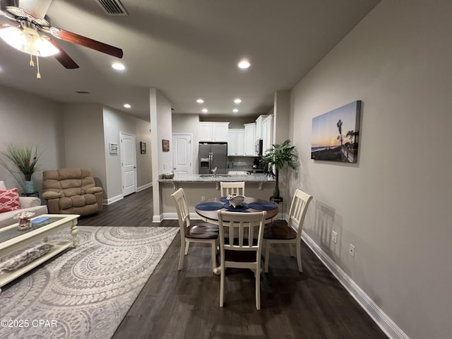 dining room featuring visible vents, baseboards, ceiling fan, dark wood-style flooring, and recessed lighting