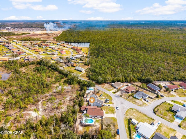 birds eye view of property with a water view and a residential view