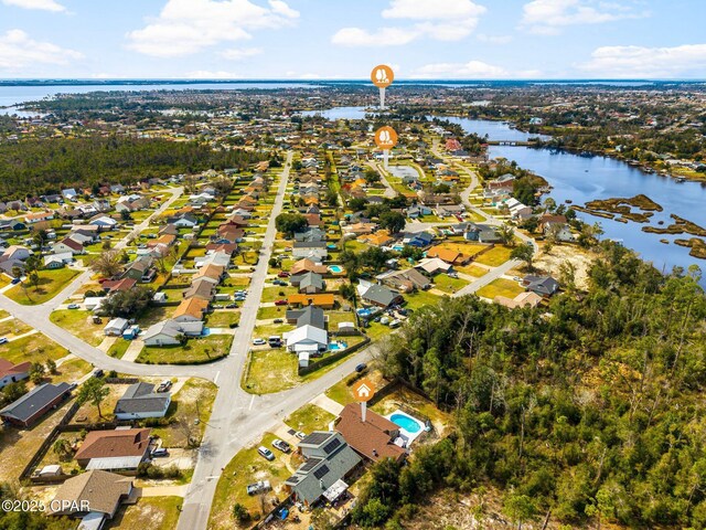 aerial view featuring a water view and a residential view