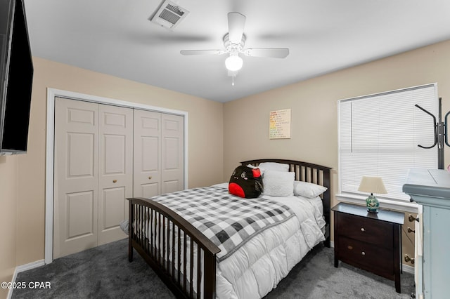 bedroom with a closet, visible vents, ceiling fan, and carpet flooring