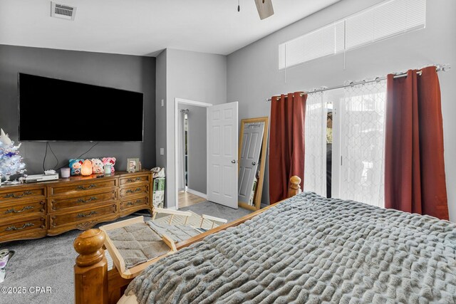 bedroom with carpet floors, visible vents, and a ceiling fan