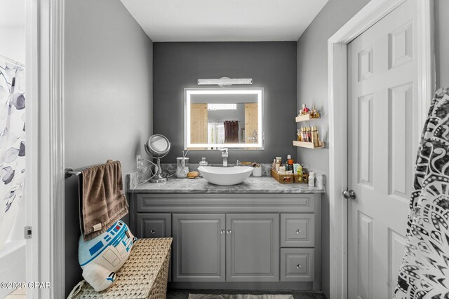 bathroom featuring vanity and a shower with shower curtain