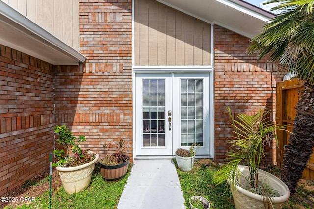 entrance to property with french doors and brick siding