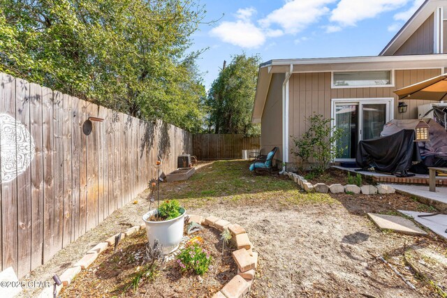 view of yard with a fenced backyard