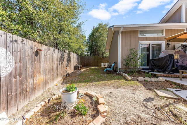 view of yard with a fenced backyard