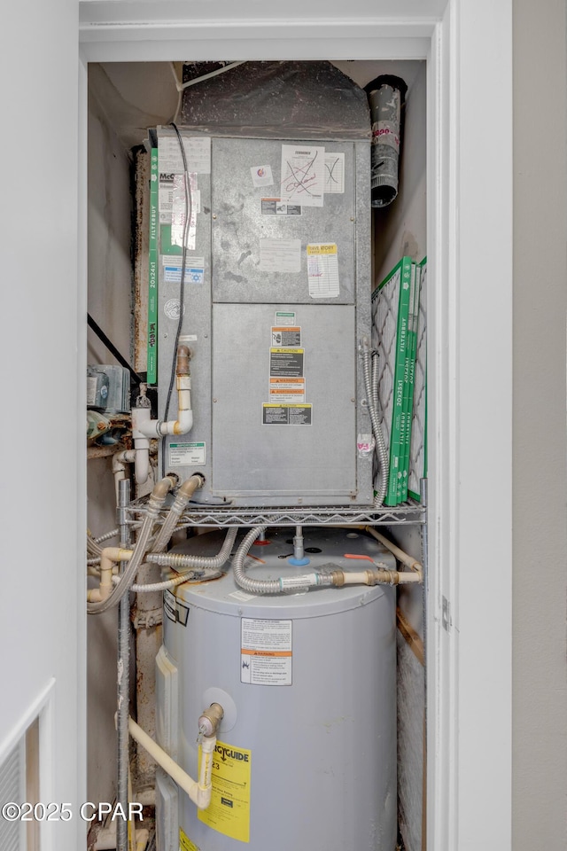 utility room with water heater