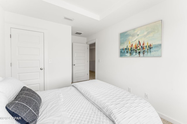 carpeted bedroom with visible vents