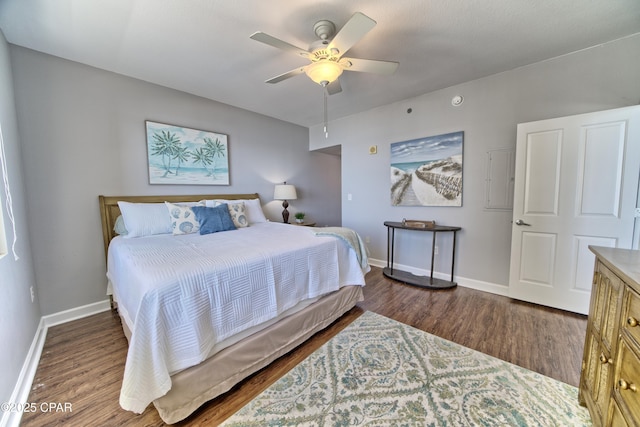 bedroom featuring dark wood-style floors, baseboards, and a ceiling fan