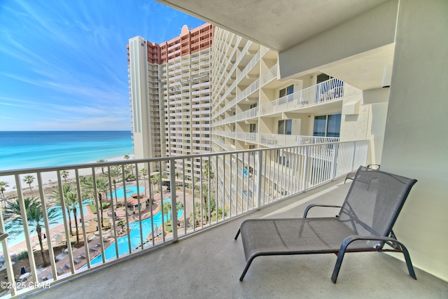 balcony featuring a water view