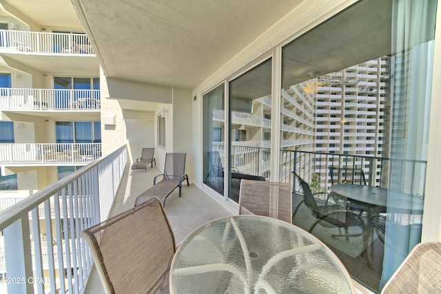 balcony featuring outdoor dining space