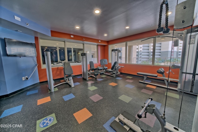 exercise room featuring recessed lighting and baseboards