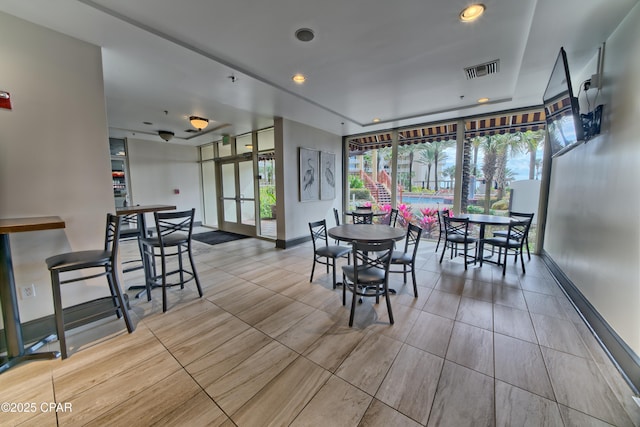 dining room with recessed lighting, visible vents, and baseboards