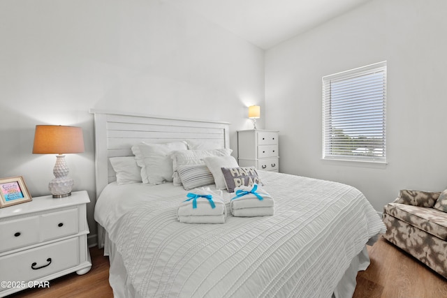 bedroom with wood finished floors