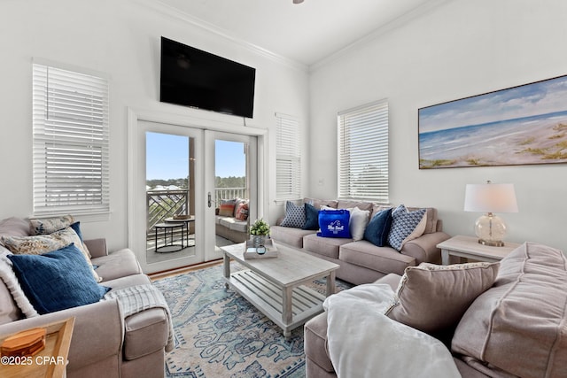 living room featuring ornamental molding and wood finished floors