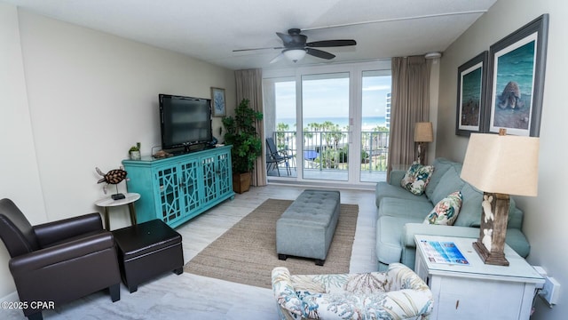 living area with ceiling fan