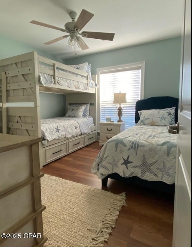 bedroom with dark wood-type flooring and ceiling fan