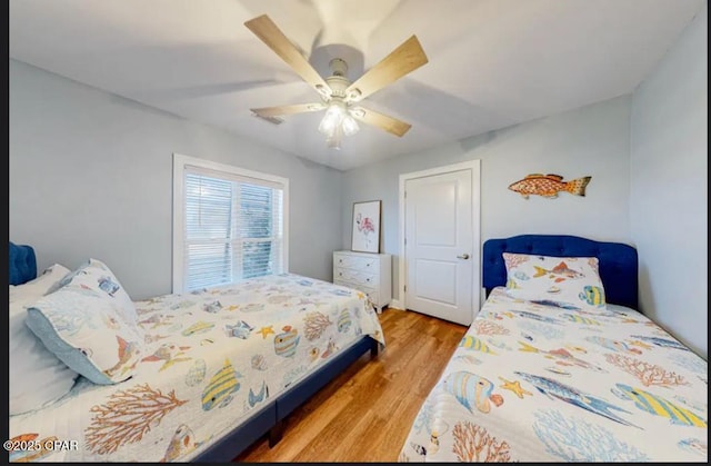 bedroom featuring ceiling fan and wood finished floors