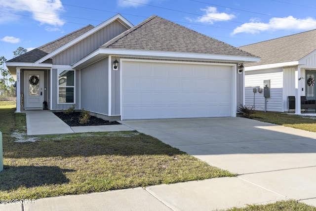 ranch-style home with a shingled roof, concrete driveway, a front lawn, and an attached garage