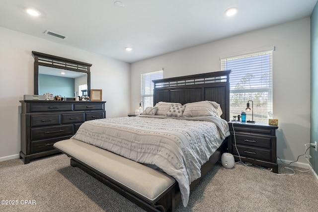 bedroom with recessed lighting, baseboards, visible vents, and light colored carpet