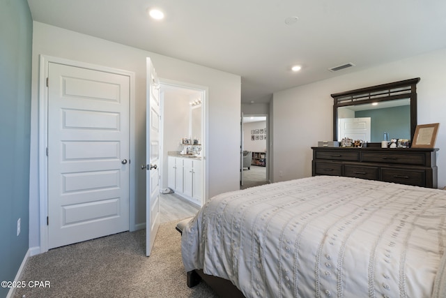 bedroom with light colored carpet, visible vents, baseboards, and recessed lighting