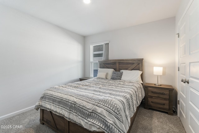 bedroom featuring carpet flooring and baseboards