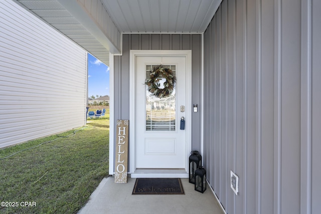 doorway to property featuring a yard