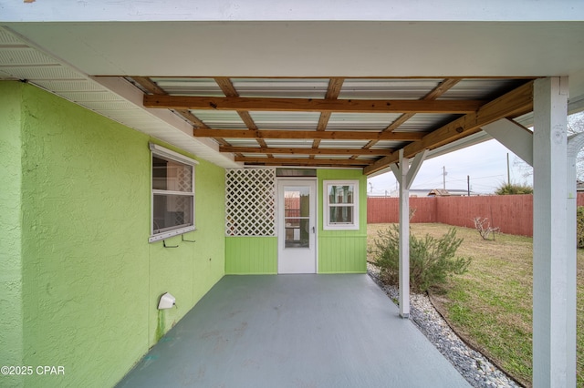 view of patio / terrace featuring fence