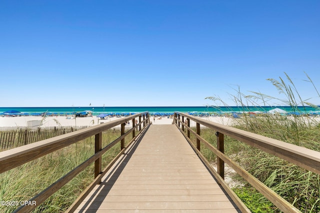 view of community featuring a water view and a view of the beach