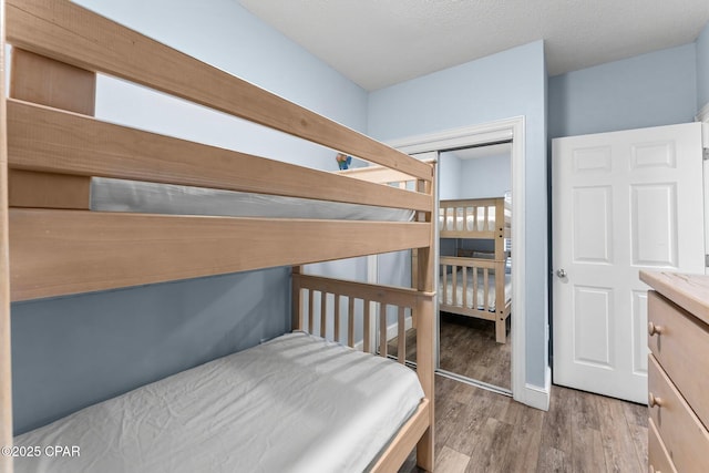 bedroom featuring wood finished floors