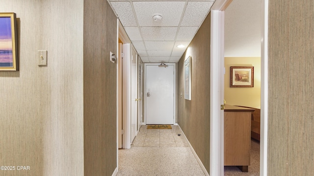 hall with a drop ceiling
