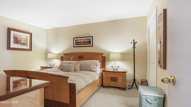 bedroom with light colored carpet