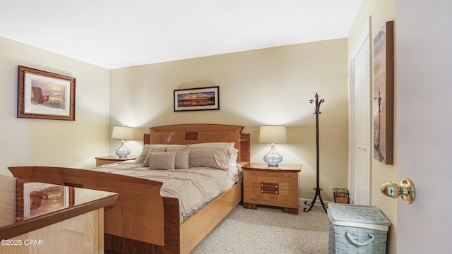 bedroom featuring light carpet