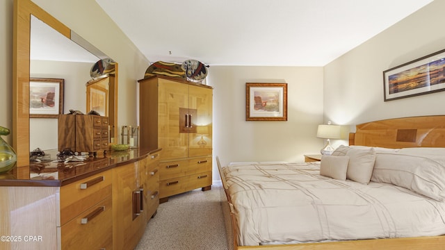 bedroom featuring light colored carpet