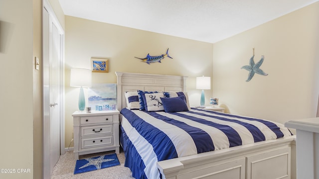 bedroom featuring light carpet