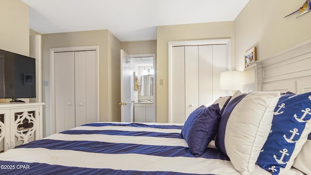 bedroom featuring multiple closets