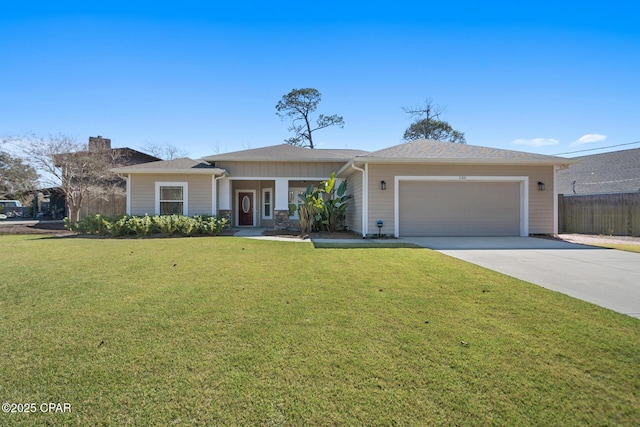 view of front facade with driveway, an attached garage, fence, and a front lawn