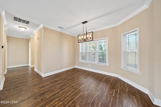 empty room featuring ornamental molding, visible vents, dark wood finished floors, and baseboards