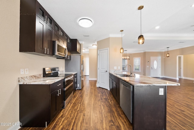 kitchen with appliances with stainless steel finishes, dark wood-style flooring, a sink, and dark brown cabinetry