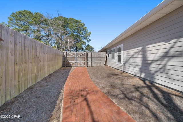 view of yard with a gate and fence