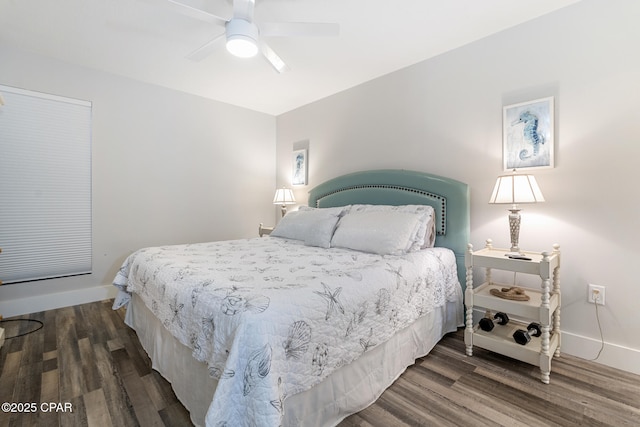 bedroom with wood finished floors, a ceiling fan, and baseboards