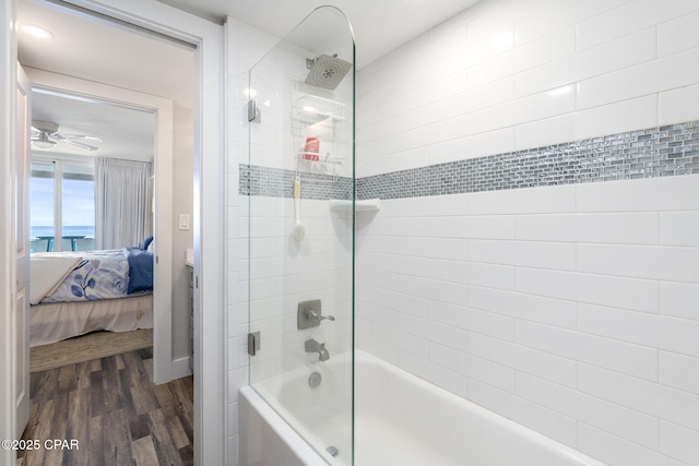 bathroom featuring ensuite bathroom, ceiling fan, shower / bathing tub combination, and wood finished floors