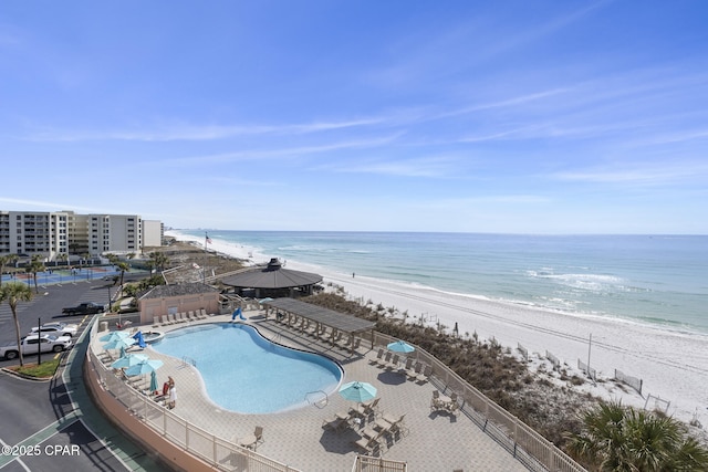 exterior space featuring a view of the beach and a water view