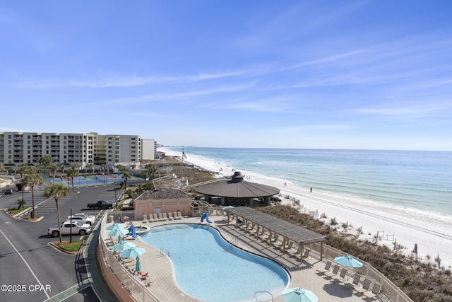 bird's eye view featuring a water view and a view of the beach