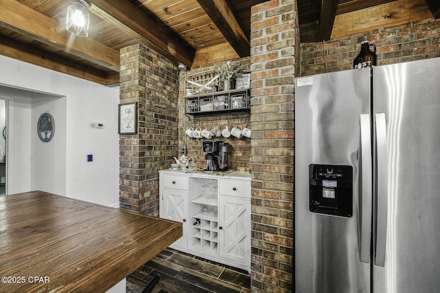 kitchen featuring brick wall, white cabinetry, open shelves, and stainless steel fridge with ice dispenser