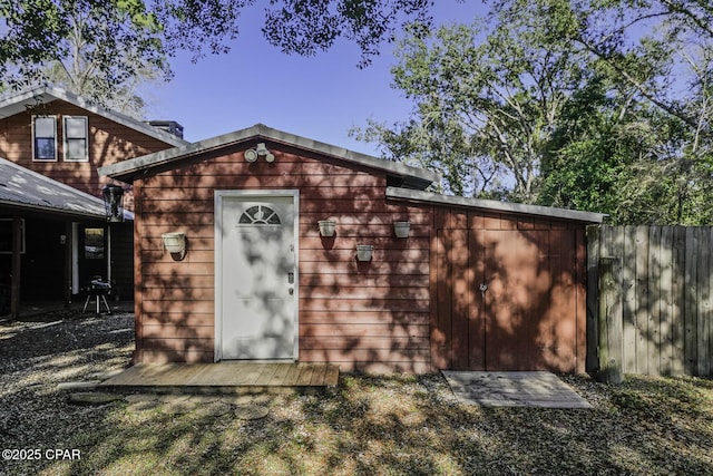 view of shed with fence