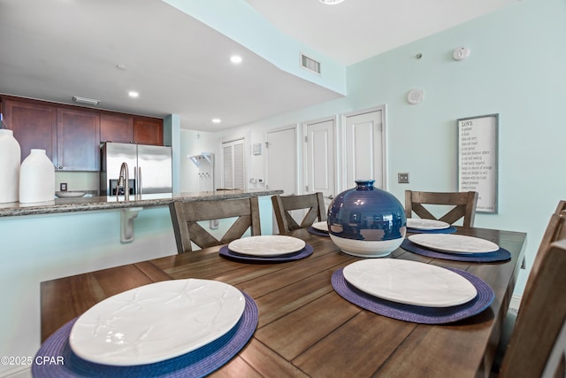 dining space with visible vents and recessed lighting