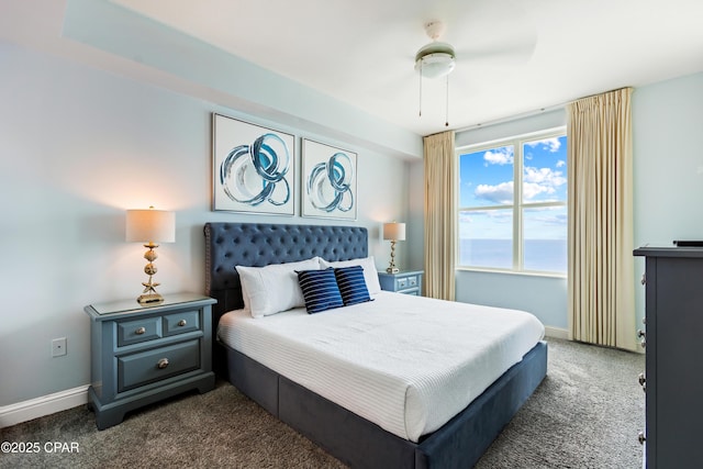 bedroom featuring baseboards and carpet floors