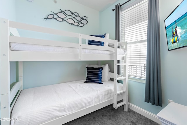 carpeted bedroom with baseboards