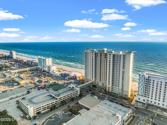 birds eye view of property with a water view and a view of city