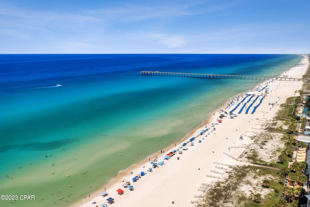 bird's eye view featuring a water view and a view of the beach
